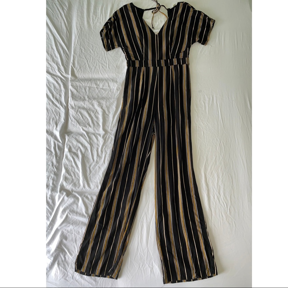 black, yellow and white striped jumpsuit